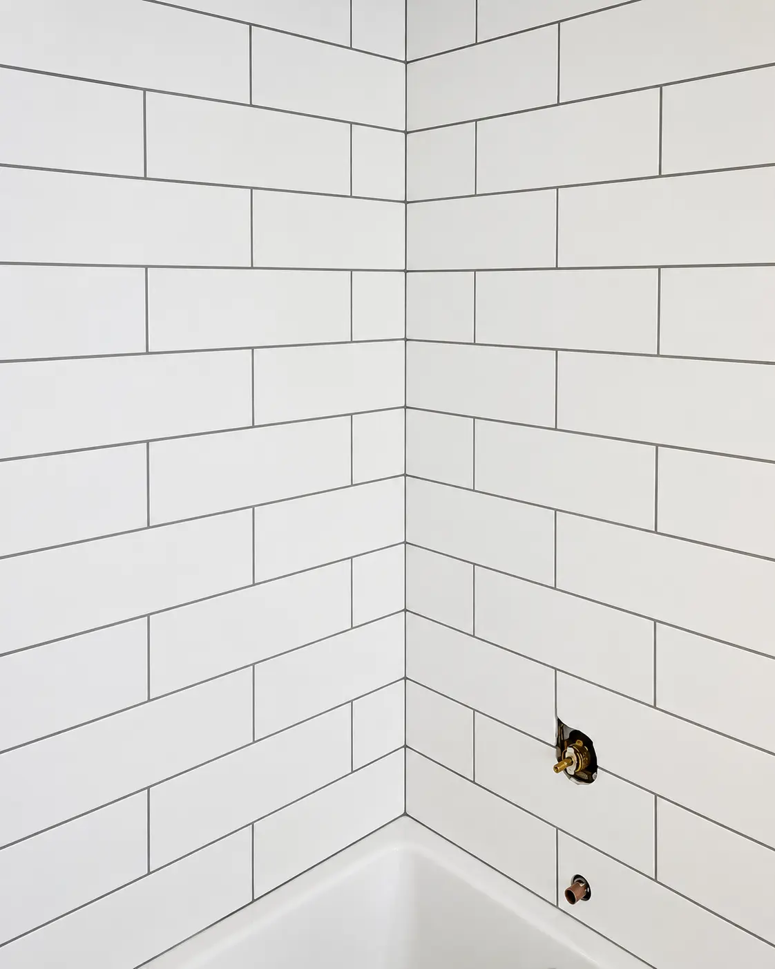 White subway tile bathroom installation by Shadi's New Look Renos
