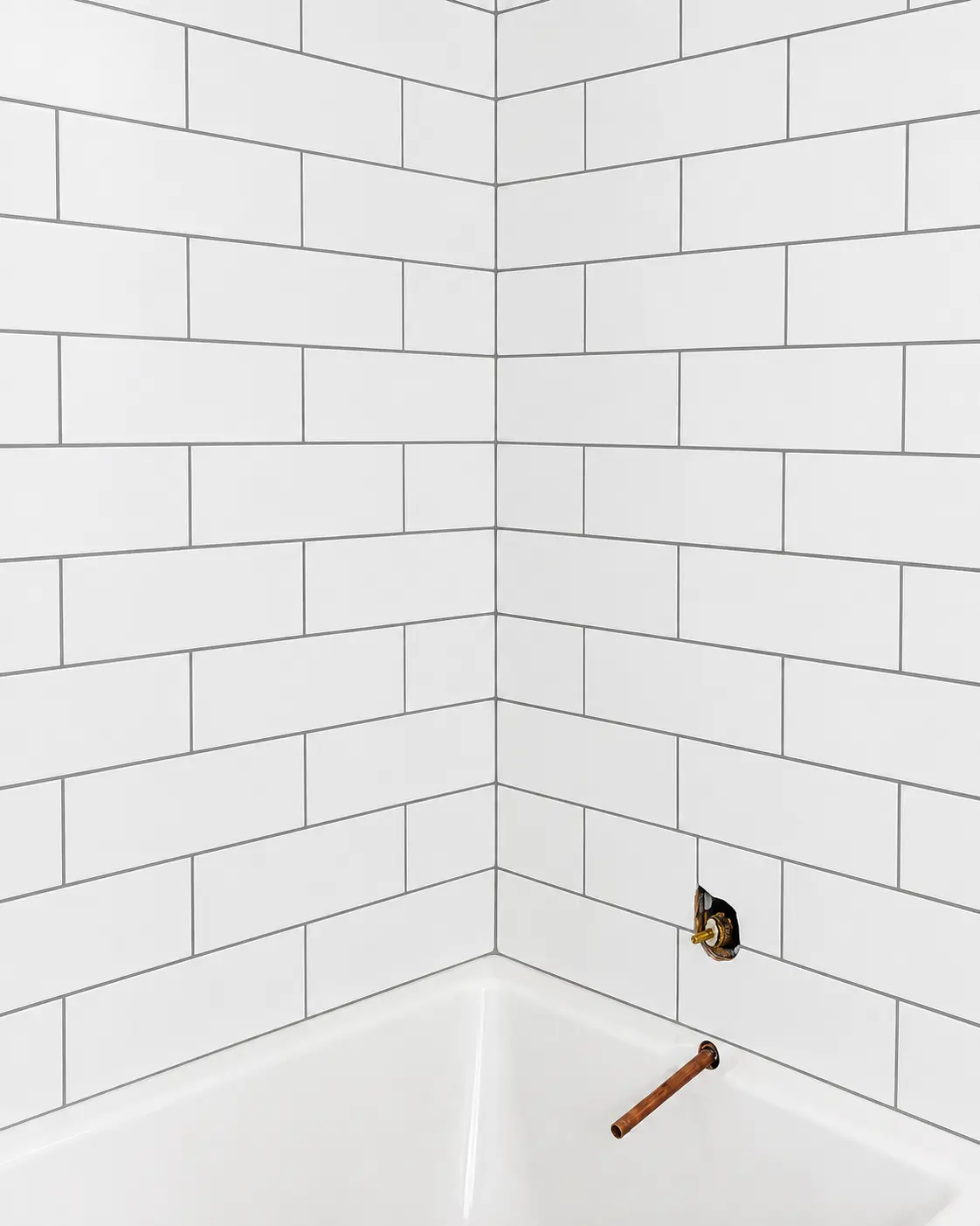 Bathroom tile detail with white subway tile installation